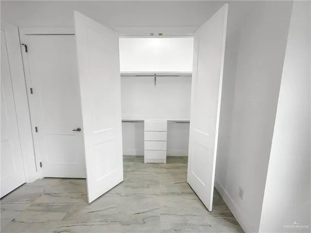 a view of an empty walk in closet