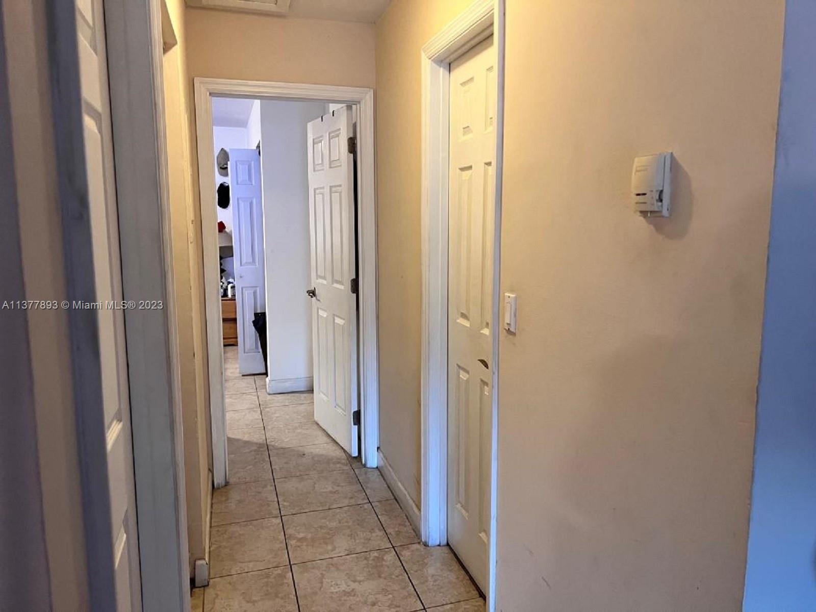 15465 Southwest 80th Street, Unit 2014 Miami, FL 33193 - Photo 12 of 23 a view of a bathroom from the hallway