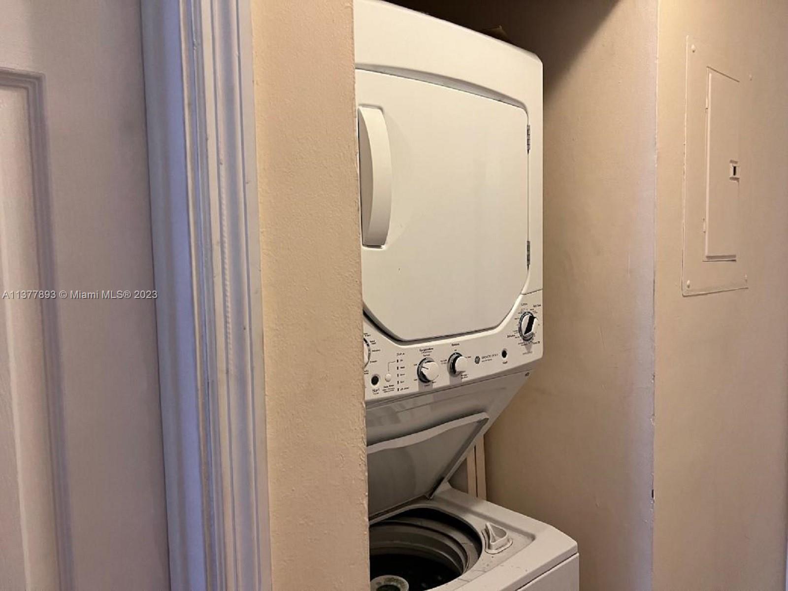 15465 Southwest 80th Street, Unit 2014 Miami, FL 33193 - Photo 9 of 23 a close view of a utility room with dryer and washer