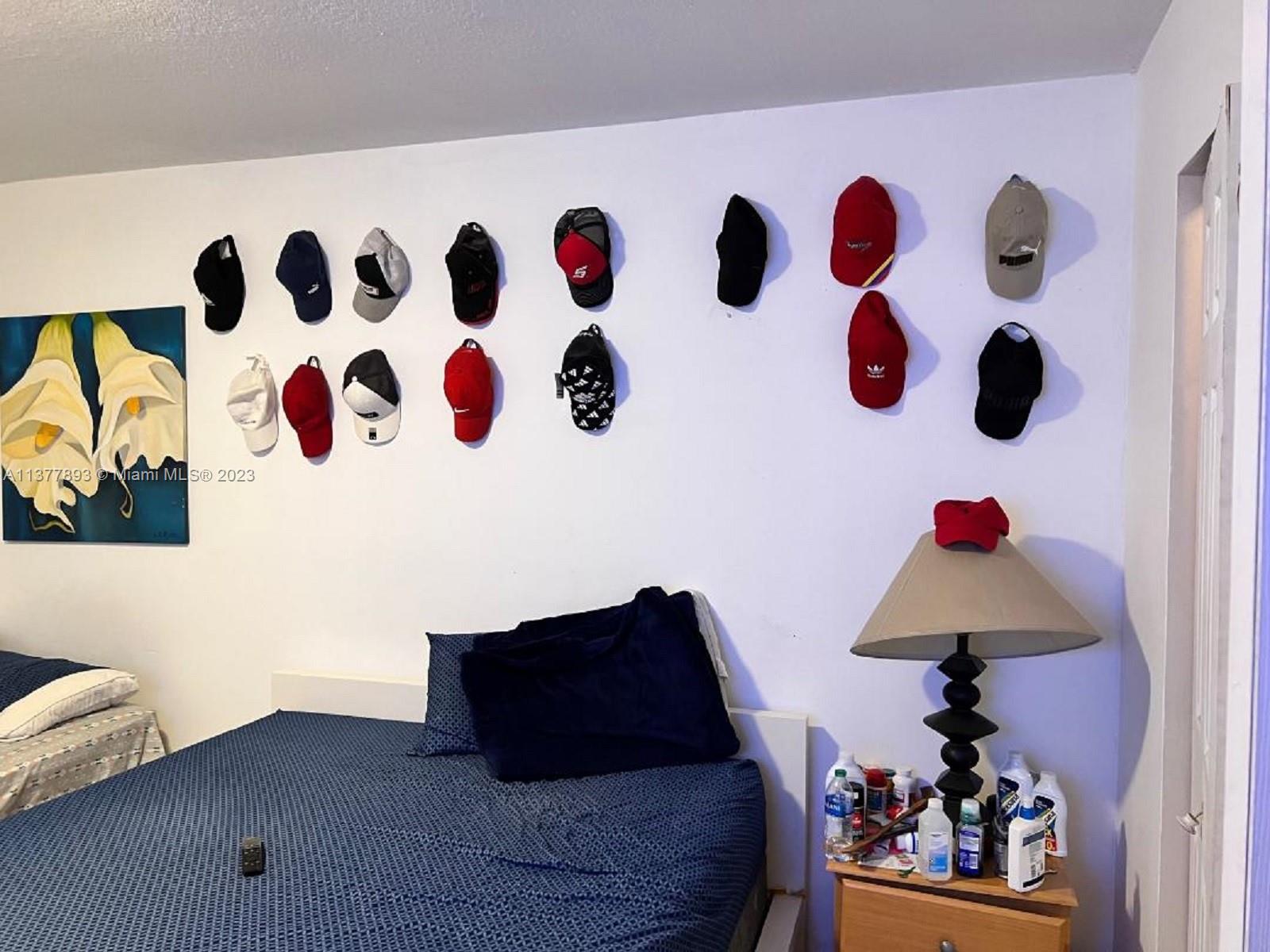 15465 Southwest 80th Street, Unit 2014 Miami, FL 33193 - Photo 10 of 23 a bed room with a bed and a window