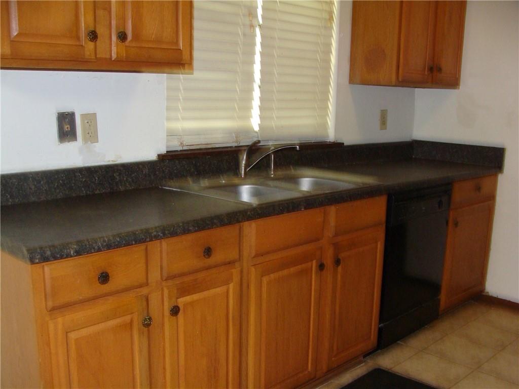 2331 Newgate Drive Decatur, GA 30035 - Photo 18 of 33 a kitchen with granite countertop white cabinets and sink