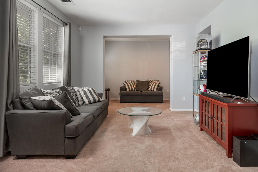 83460 Lone Star Road Indio, CA 92203 - Photo 2 of 40 a living room with furniture and a flat screen tv