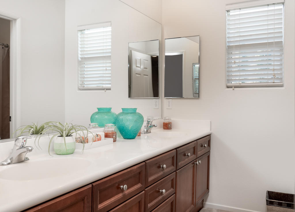 83460 Lone Star Road Indio, CA 92203 - Photo 26 of 40 a bathroom with a sink a mirror and window