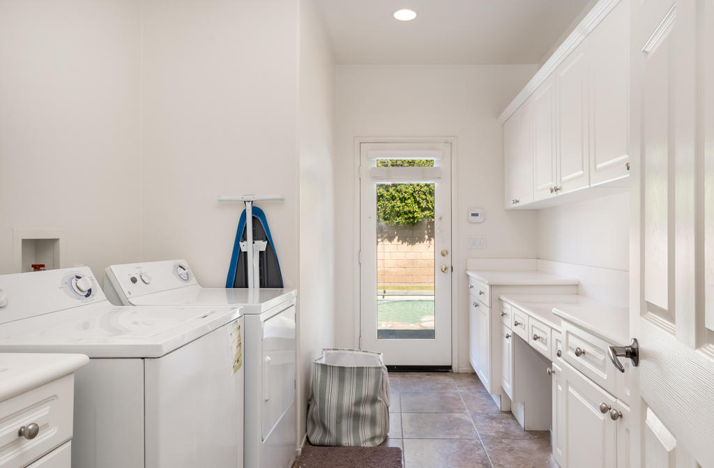 83460 Lone Star Road Indio, CA 92203 - Photo 30 of 40 a view of a kitchen with sink washer and dryer
