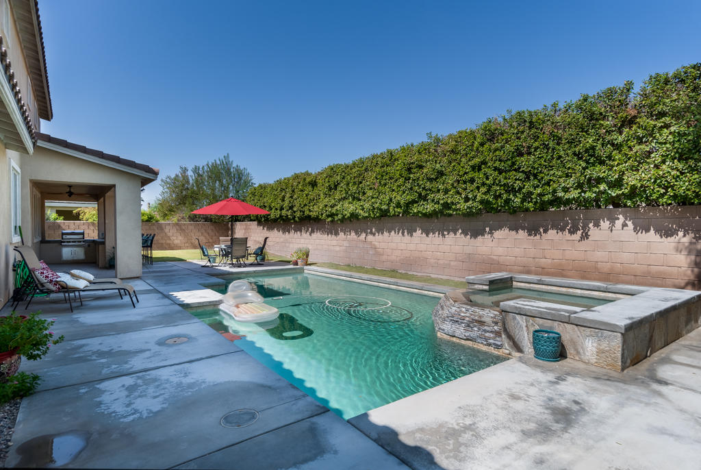 83460 Lone Star Road Indio, CA 92203 - Photo 32 of 40 a backyard of a house with table and chairs