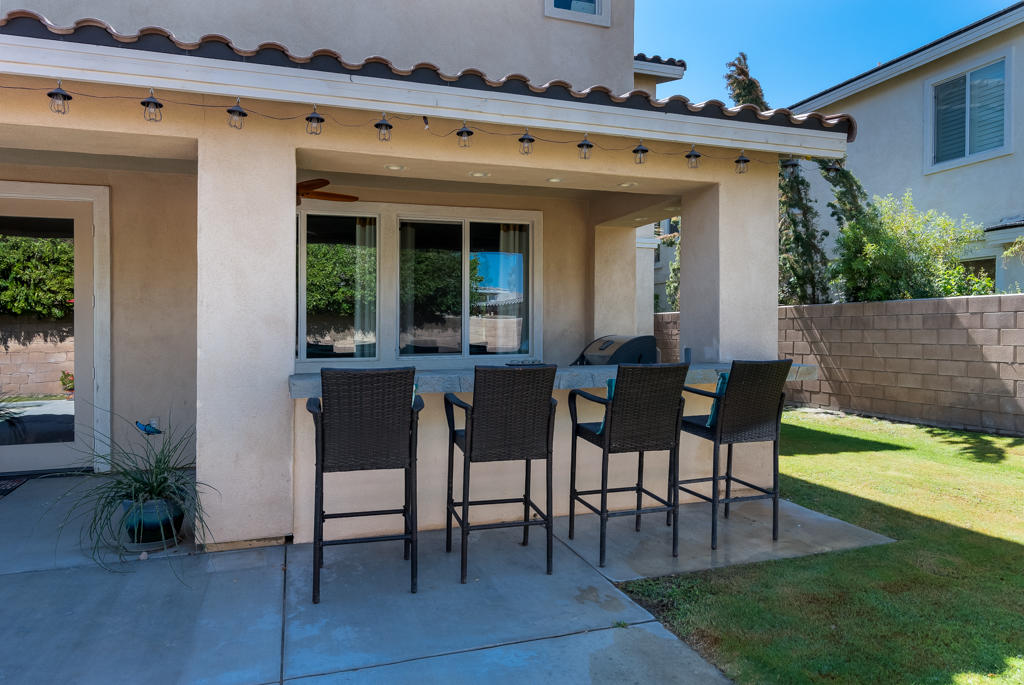 83460 Lone Star Road Indio, CA 92203 - Photo 35 of 40 a view of a porch with chairs and table in patio