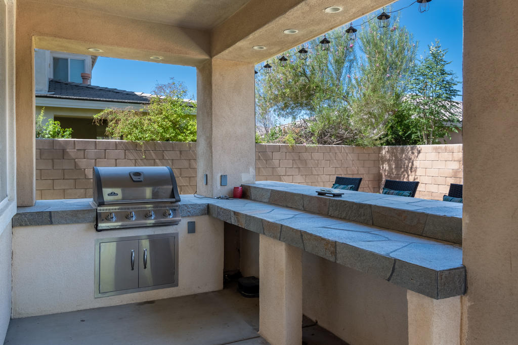 83460 Lone Star Road Indio, CA 92203 - Photo 36 of 40 a kitchen with a sink and a stove