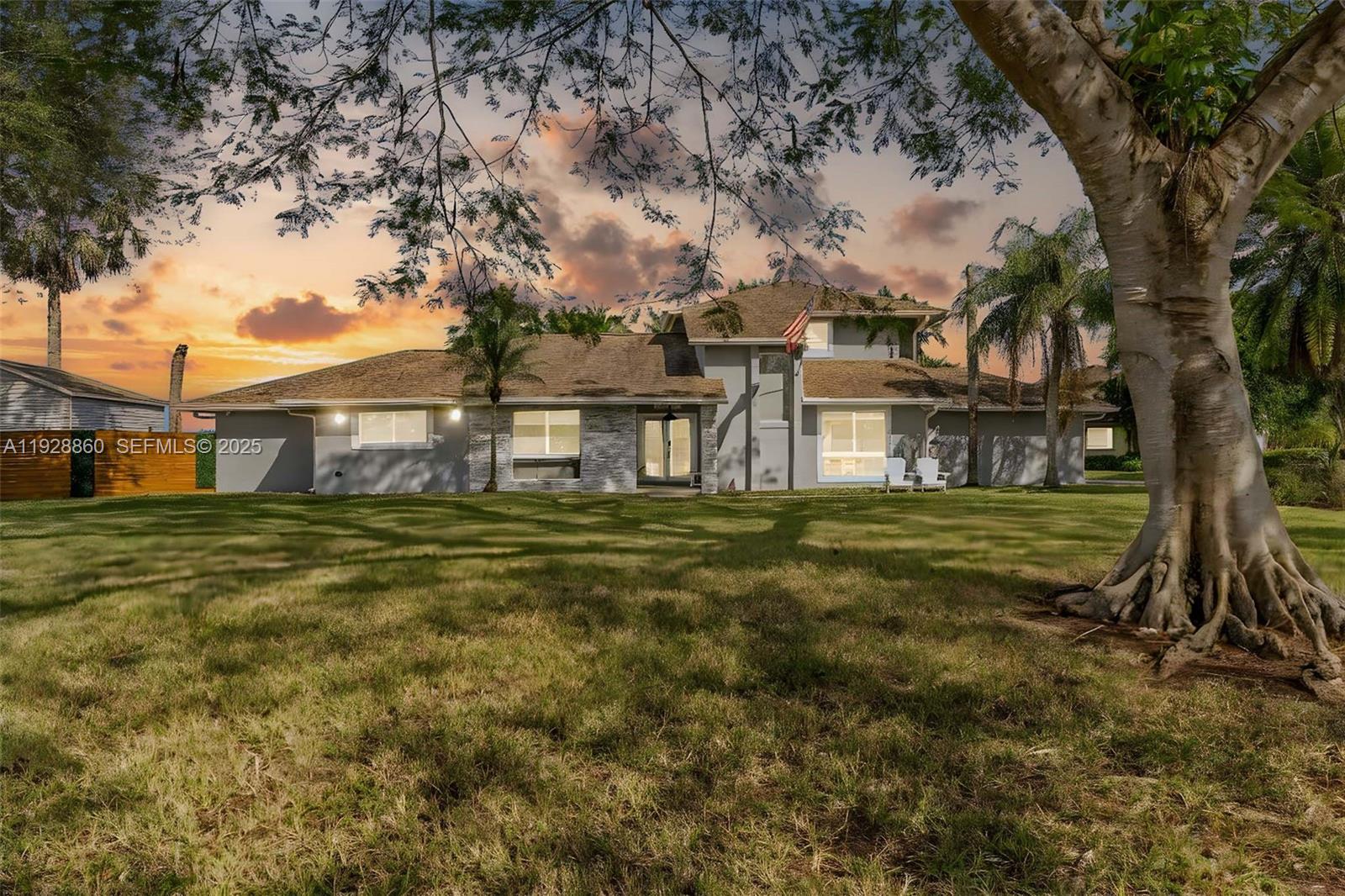 a view of a house with a yard