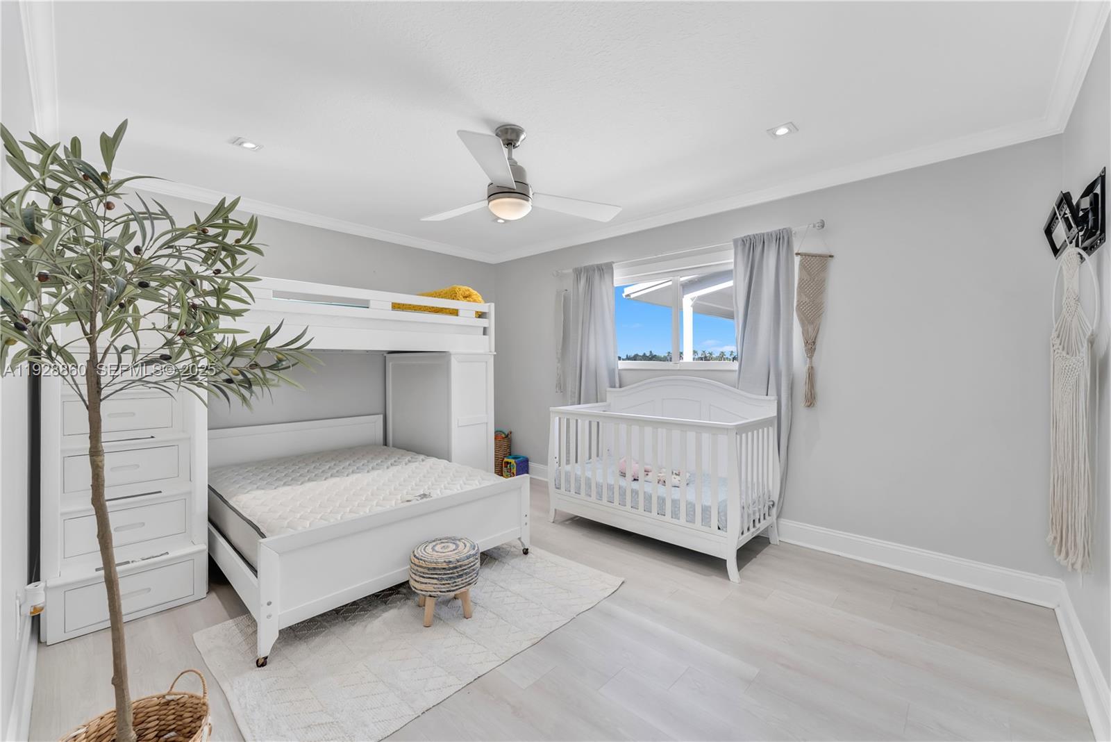 15151 Southwest 164th Terrace Miami, FL 33187 - Photo 14 of 37 a bedroom with furniture and a potted plant