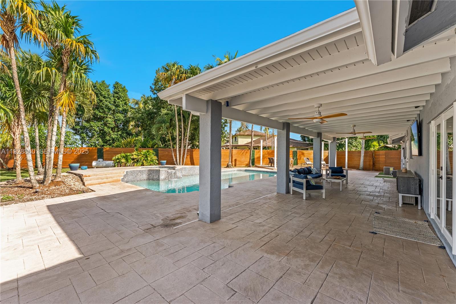 15151 Southwest 164th Terrace Miami, FL 33187 - Photo 25 of 37 a view of a swimming pool with a patio