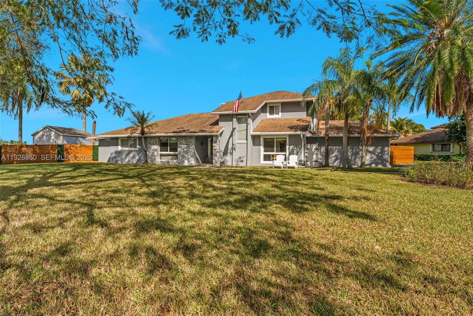 15151 Southwest 164th Terrace Miami, FL 33187 - Photo 32 of 37 a front view of a house with a garden