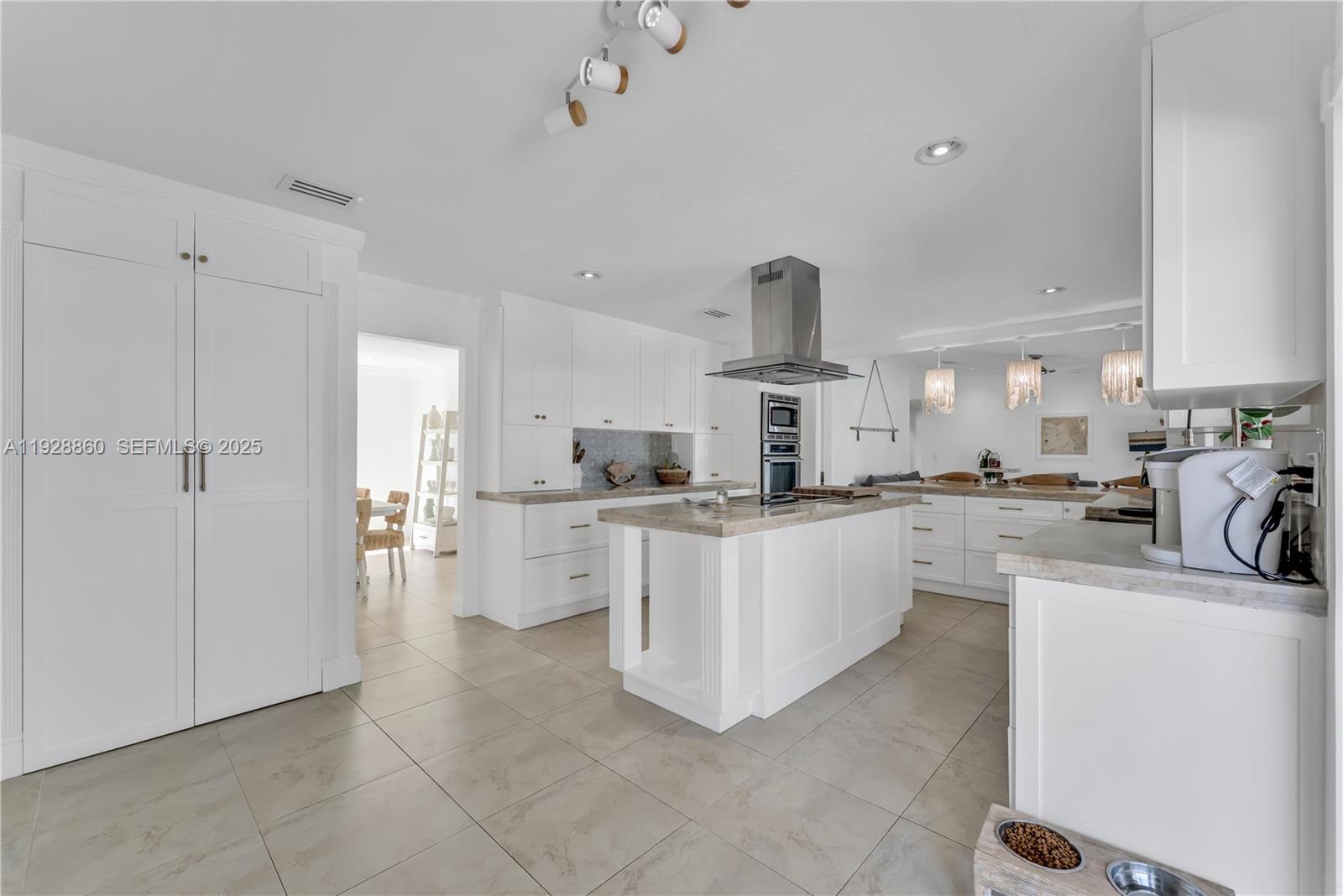 15151 Southwest 164th Terrace Miami, FL 33187 - Photo 4 of 37 a kitchen with white cabinets and white appliances