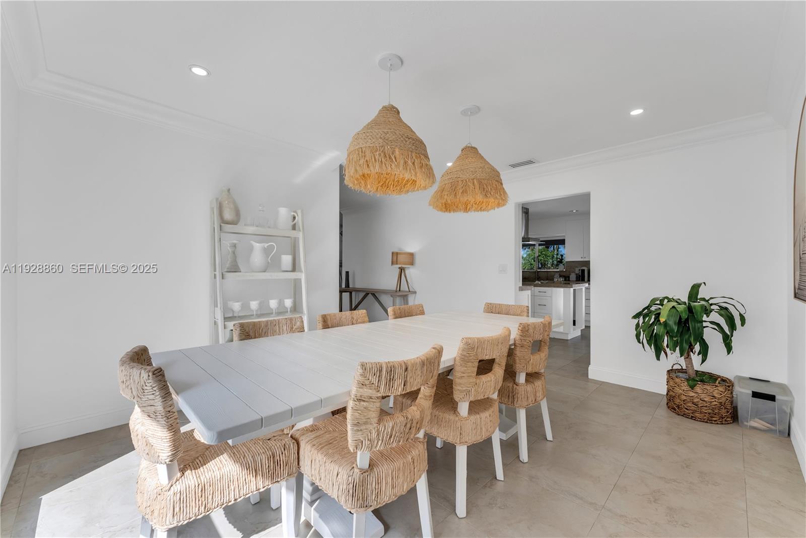 15151 Southwest 164th Terrace Miami, FL 33187 - Photo 7 of 37 a view of a dining room with furniture and a potted plant