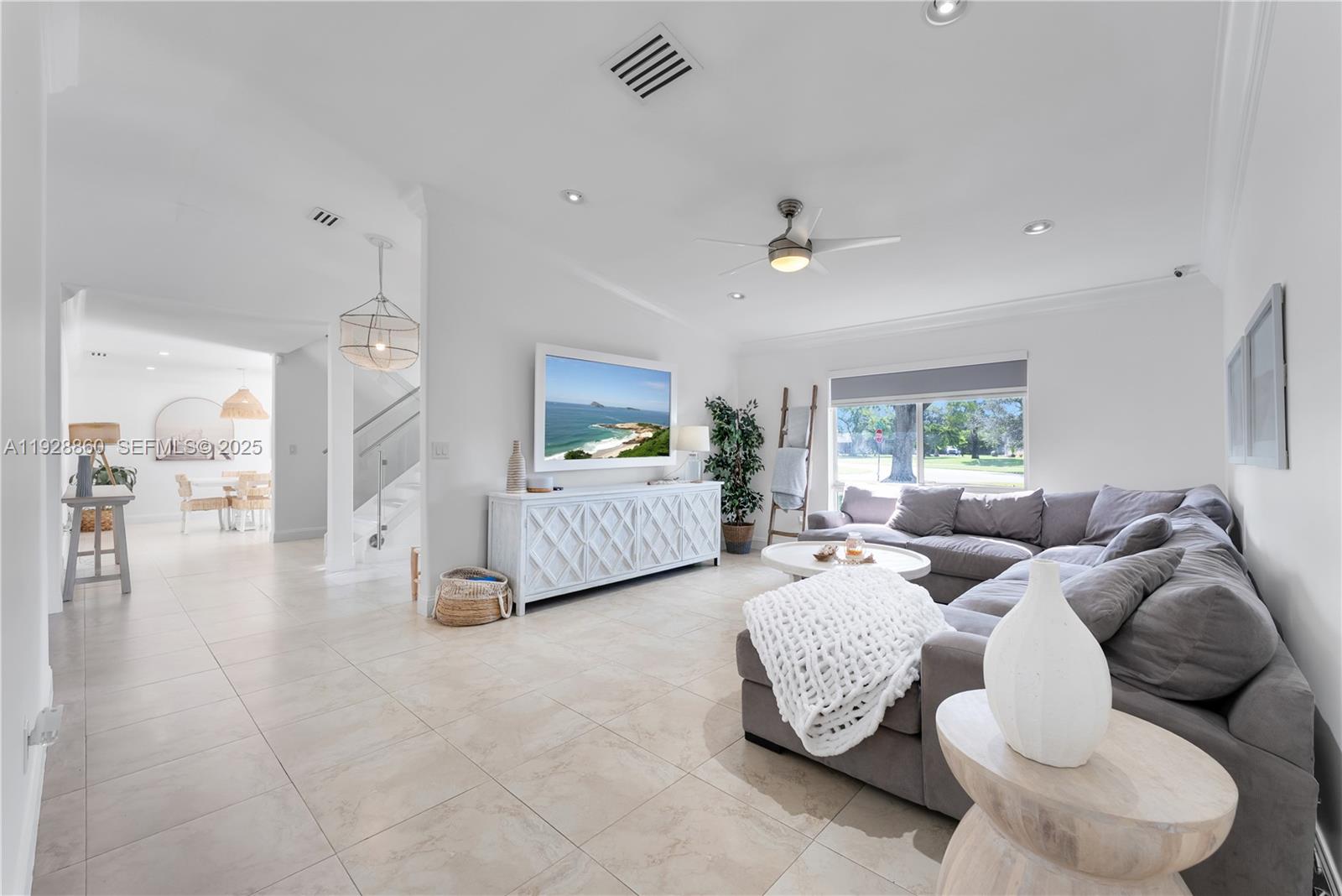 15151 Southwest 164th Terrace Miami, FL 33187 - Photo 10 of 37 a living room with furniture and a chandelier
