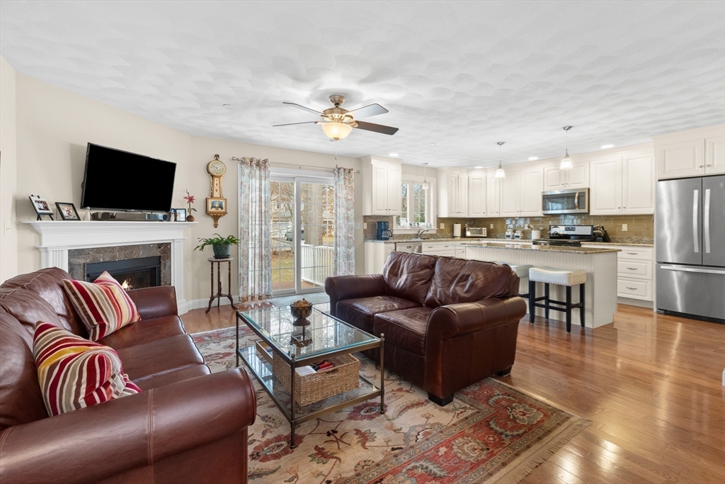 20 Freedom Way, Unit 20 Merrimac, MA 01860 - Photo 13 of 35 a living room with furniture fireplace and a flat screen tv