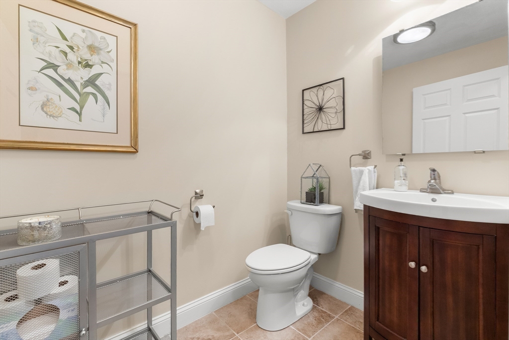 20 Freedom Way, Unit 20 Merrimac, MA 01860 - Photo 19 of 35 a bathroom with a toilet sink and mirror