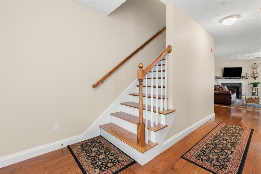 20 Freedom Way, Unit 20 Merrimac, MA 01860 - Photo 23 of 35 a view of entryway with wooden floor and stairs