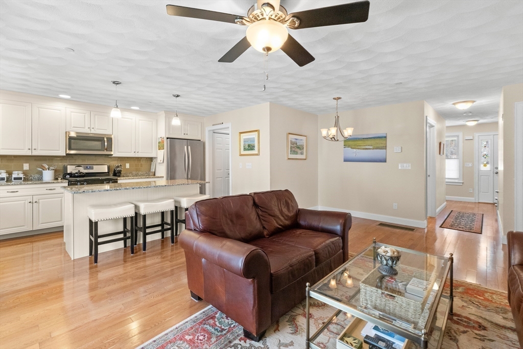 20 Freedom Way, Unit 20 Merrimac, MA 01860 - Photo 10 of 35 a living room with furniture and kitchen view