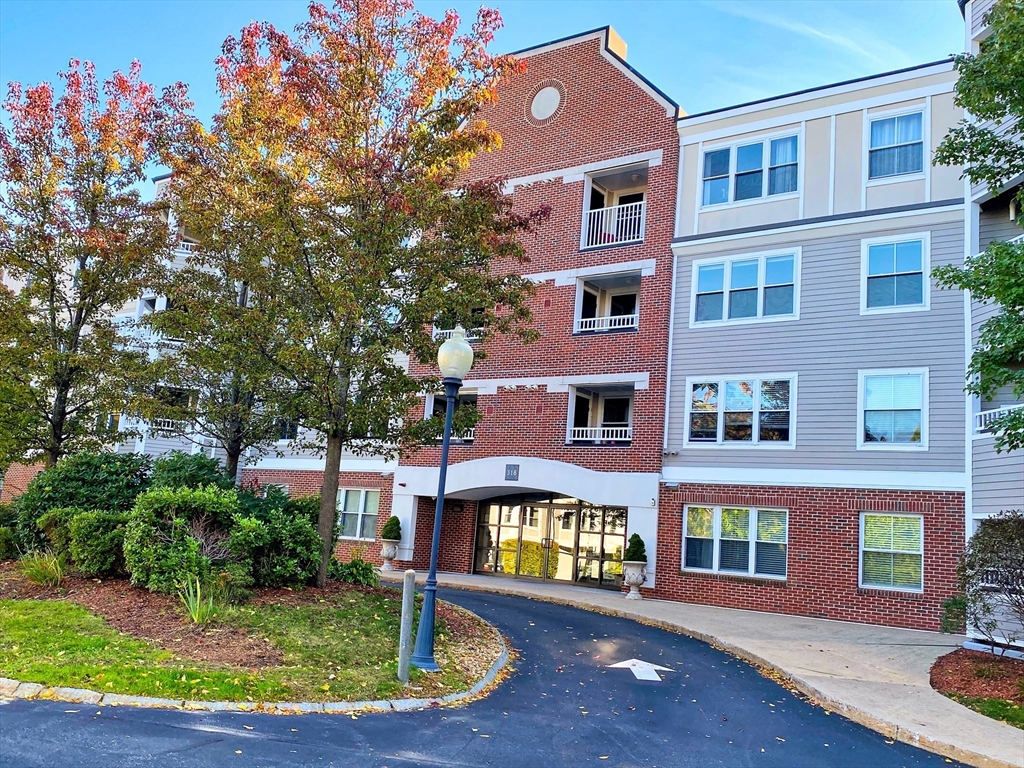 a front view of a building with garden