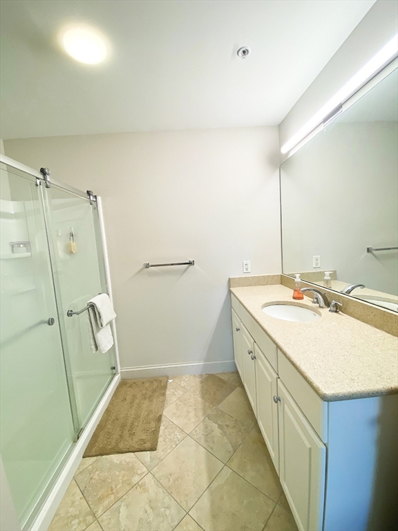 318 Rindge Avenue, Unit 405 Cambridge, MA 02140 - Photo 18 of 25 a spacious bathroom with a sink a toilet and shower