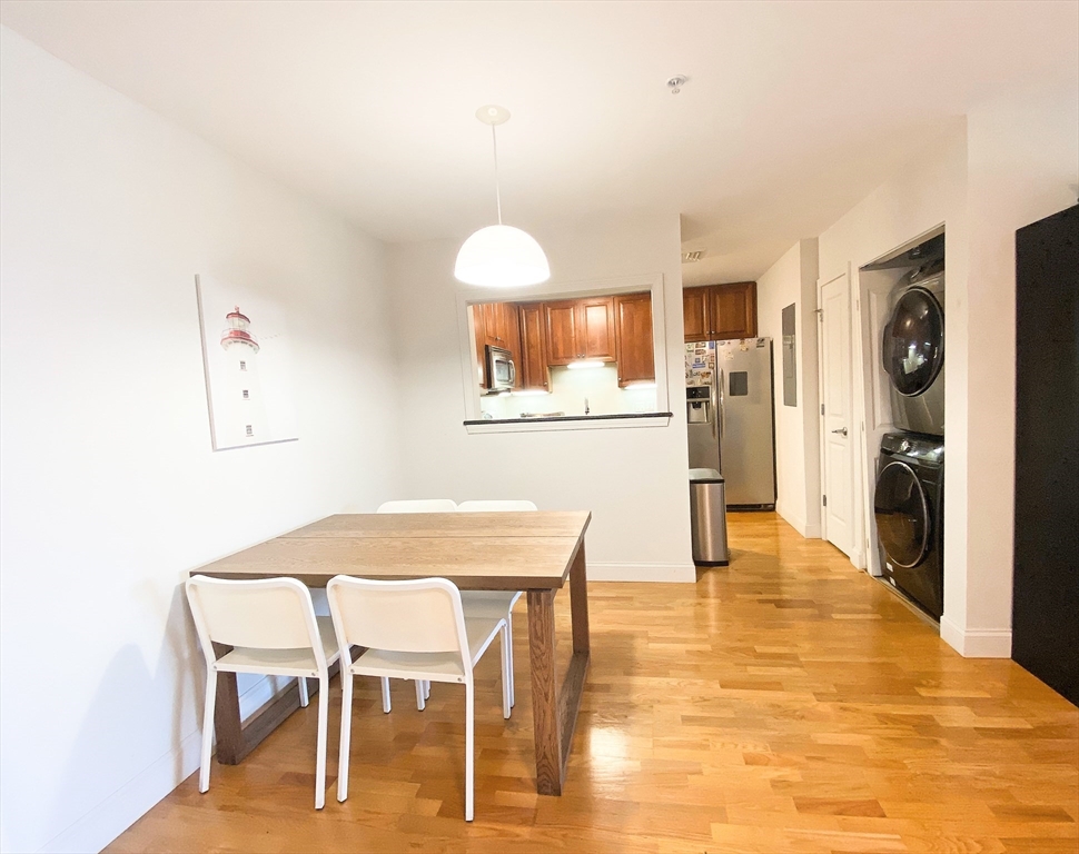 318 Rindge Avenue, Unit 405 Cambridge, MA 02140 - Photo 9 of 25 a view of a dining room with furniture