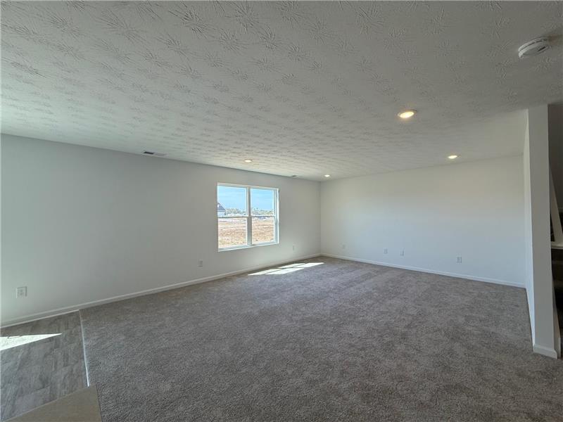 4005 Chakeres Avenue Springfield, OH 45505 - Photo 9 of 19 This versatile living area features plush carpeting and abundant natural light.