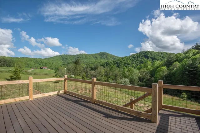 a kitchen with granite countertop a sink stove and refrigerator