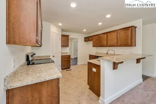a view of an empty room and a window