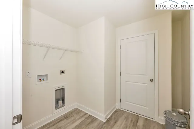 a spacious bedroom with a bed and a cabinets