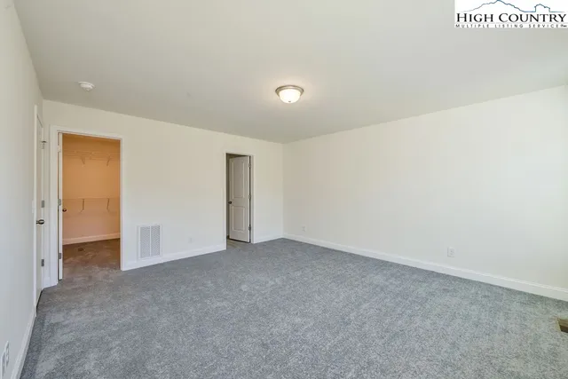 a view of a lake with a yard