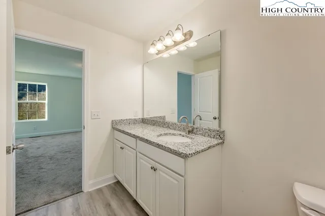 a view of an empty room with wooden walls