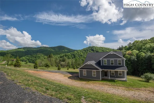 a large kitchen with stainless steel appliances granite countertop a stove a sink and a refrigerator