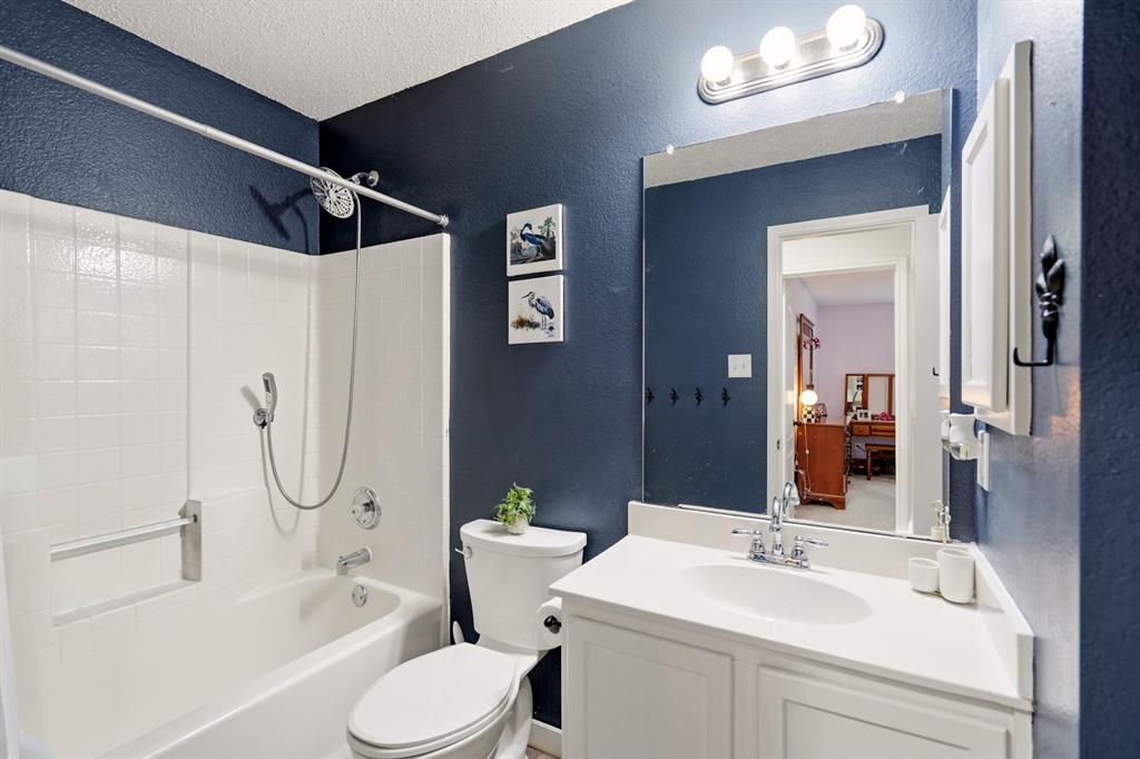 1213 Hampton Drive Forney, TX 75126 - Photo 5 of 27 a bathroom with a toilet sink and shower