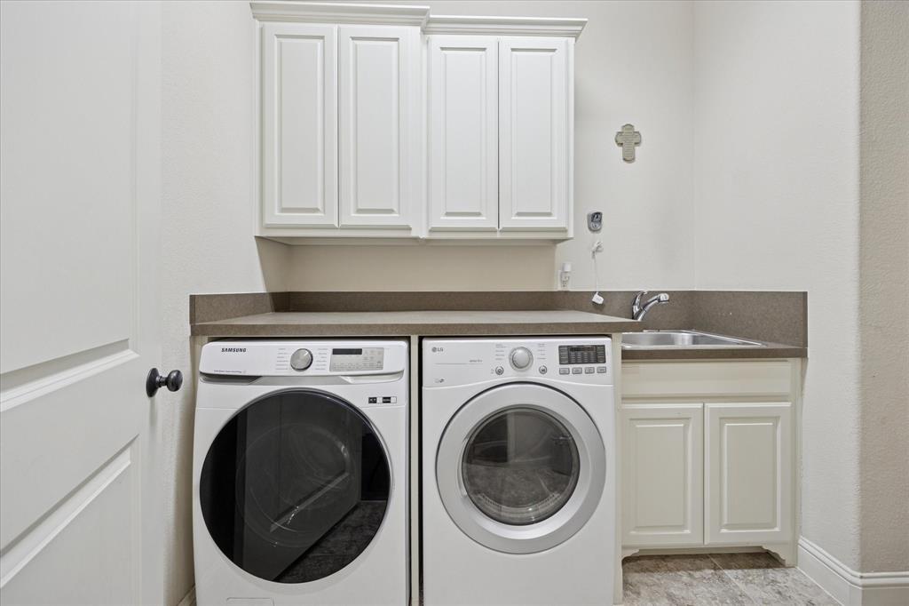 580 Butchart Drive Prosper, TX 75078 - Photo 32 of 40 Washroom featuring washer and clothes dryer and cabinet space