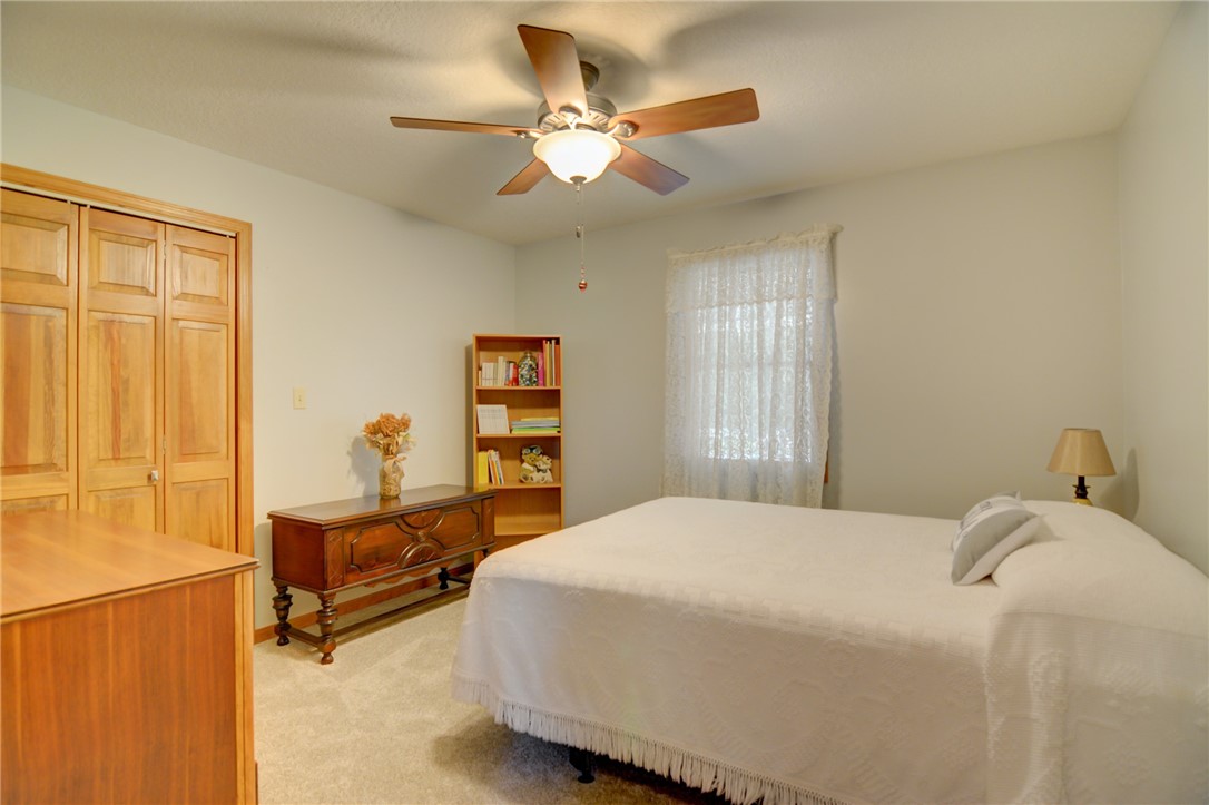 9234 Cabin Road Argenta, IL 62501 - Photo 27 of 47 a bedroom with a bed dresser and a window