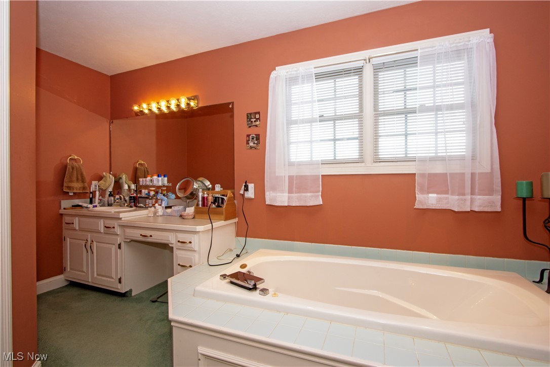10050 Mennonite Road Rittman, OH 44270 - Photo 19 of 42 Full bath featuring vanity and a bath