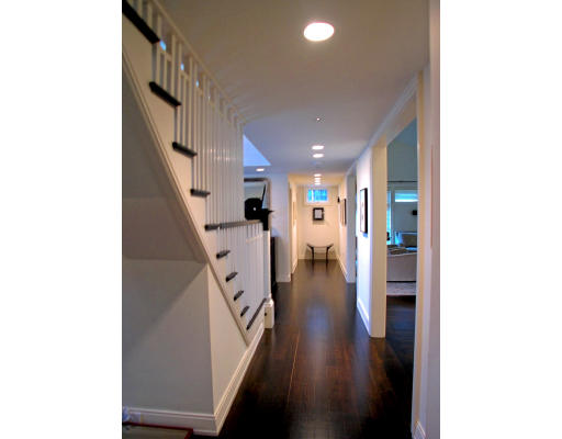 16 Hancock Road Weston, MA 02493 - Photo 17 of 23 a hallway with wooden floor and staircase