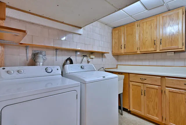 a utility room with dryer and washer