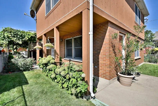 a front view of a house with garden