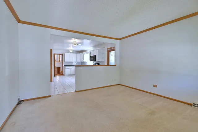 a view of a kitchen with a sink and cabinet area