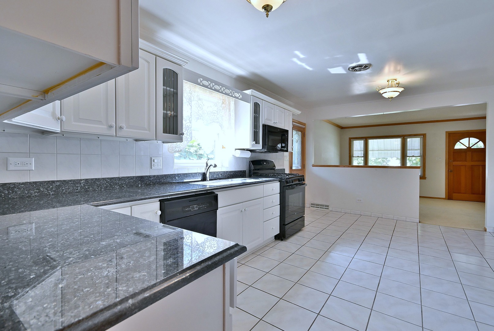 2247 Elm Street River Grove, IL 60171 - Photo 6 of 31 a kitchen with a sink window and cabinets
