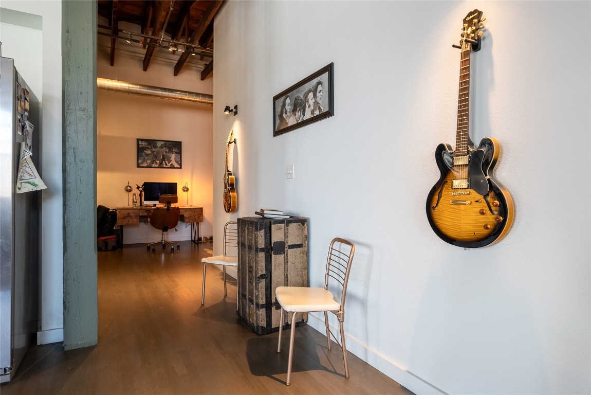 102 East 2nd Street, Unit 201 Taylor, TX 76574 - Photo 14 of 19 a view of a hallway with living room and furniture