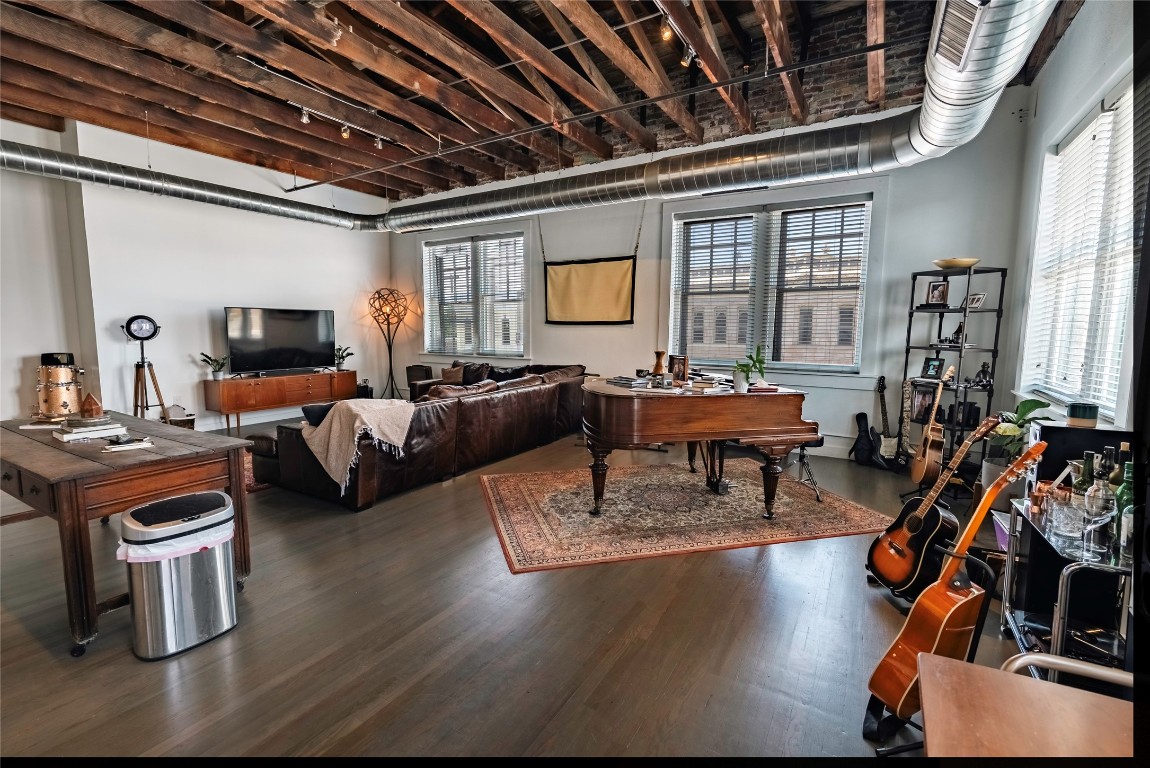 102 East 2nd Street, Unit 201 Taylor, TX 76574 - Photo 19 of 19 a living room with fireplace furniture and a flat screen tv