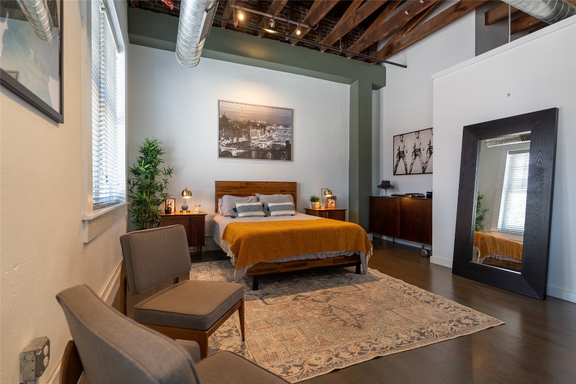 102 East 2nd Street, Unit 201 Taylor, TX 76574 - Photo 6 of 19 a bedroom with a bed and a couch