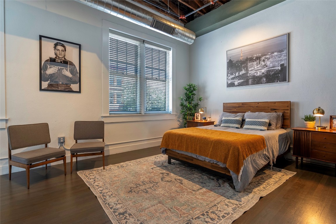 102 East 2nd Street, Unit 201 Taylor, TX 76574 - Photo 7 of 19 a bedroom with a bed a couch and a window