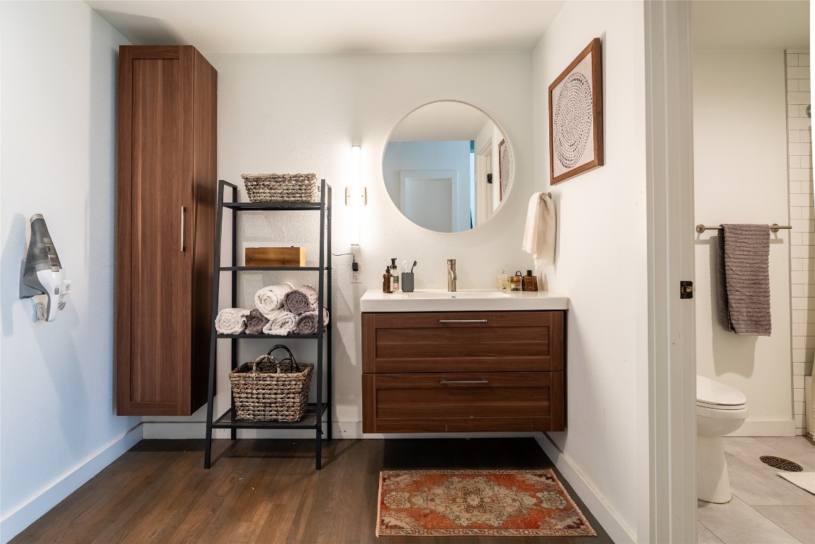 102 East 2nd Street, Unit 201 Taylor, TX 76574 - Photo 8 of 19 a room with a walk in closet and wooden floor