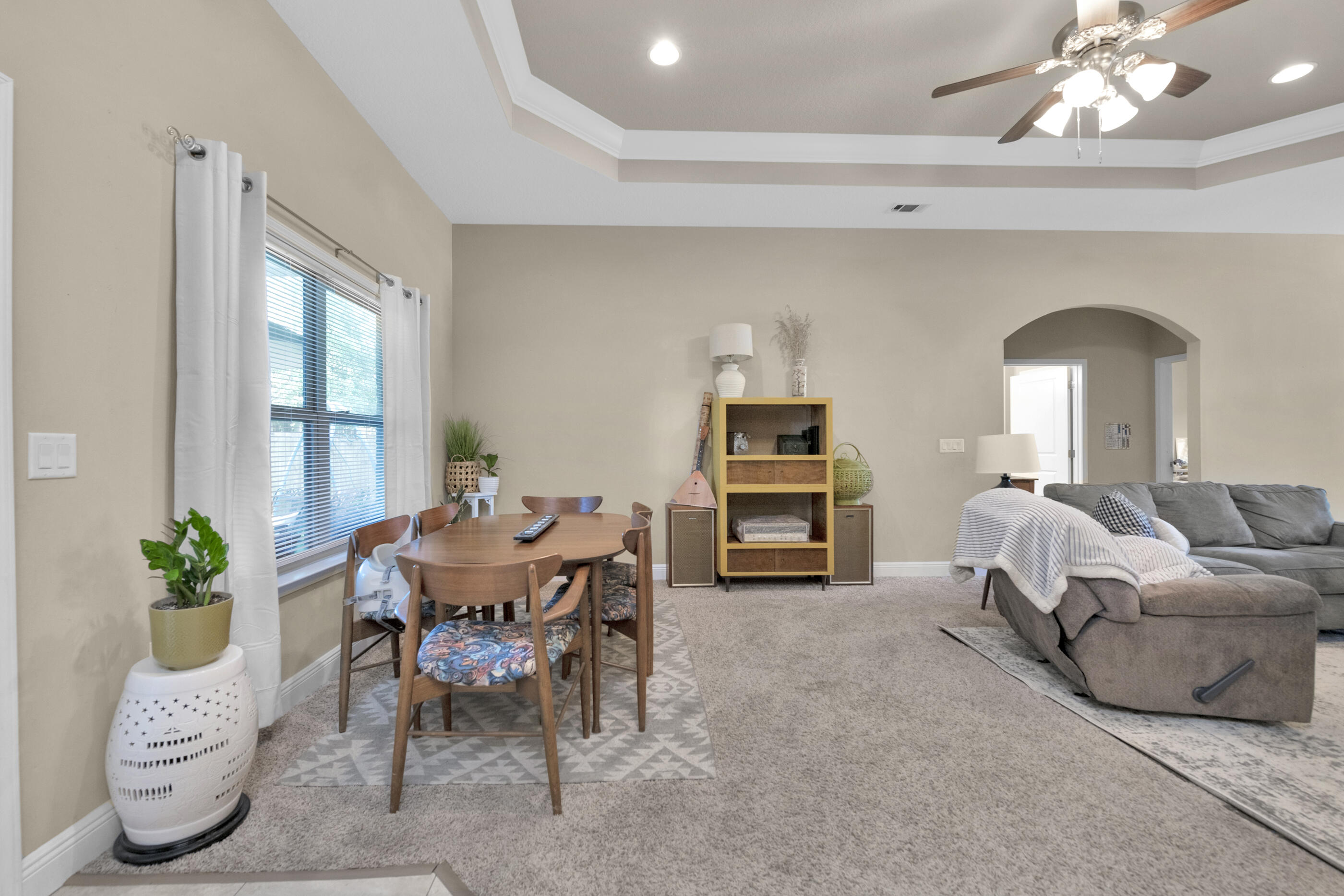 4569 Hermosa Road Crestview, FL 32539 - Photo 6 of 22 a living room with furniture a fireplace and a potted plant