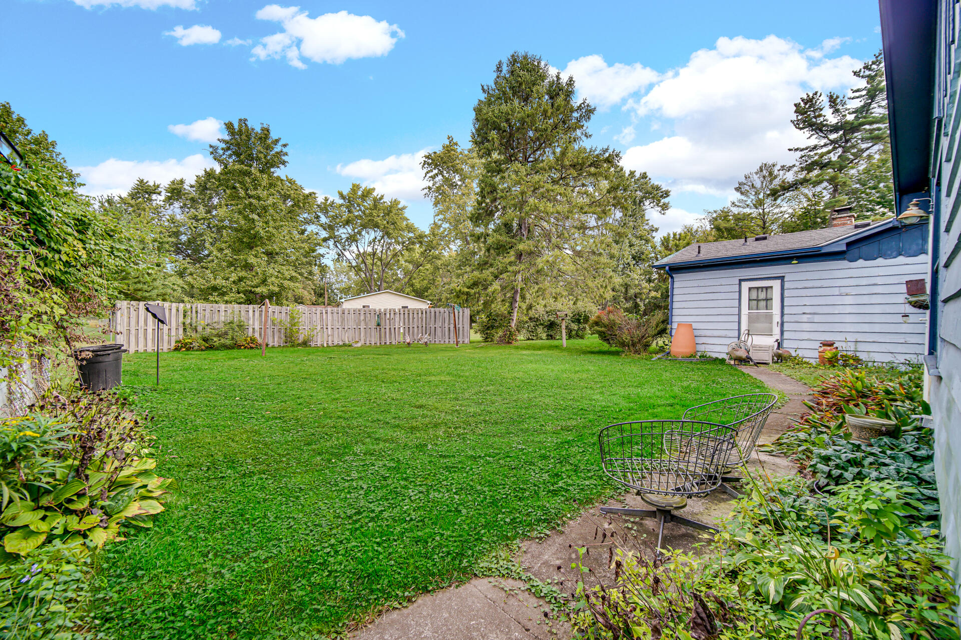 1288 North Brummitt Road Chesterton, IN 46304 - Photo 19 of 23 a view of a house with backyard and garden