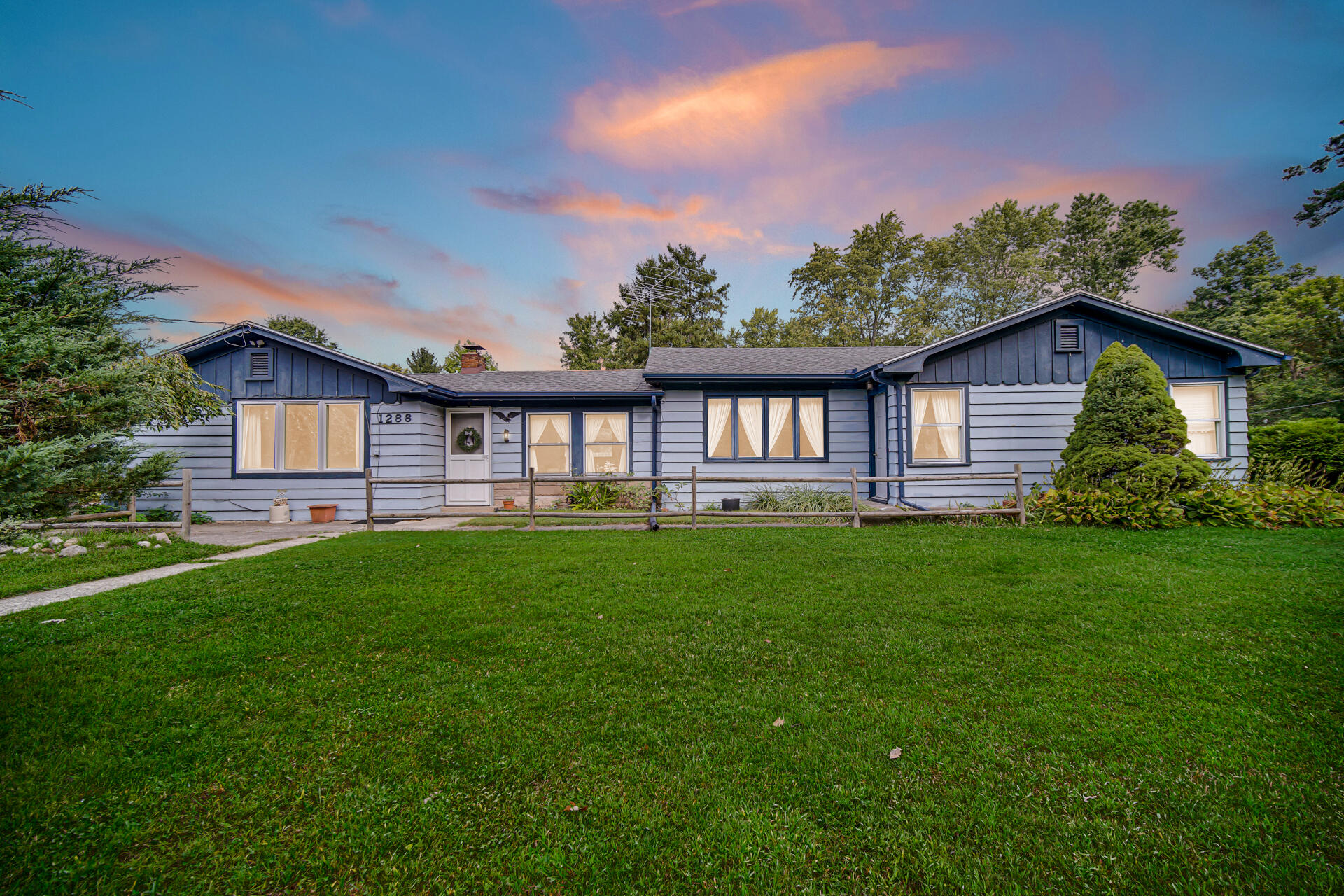 1288 North Brummitt Road Chesterton, IN 46304 - Photo 23 of 23 a view of a house with a yard and deck