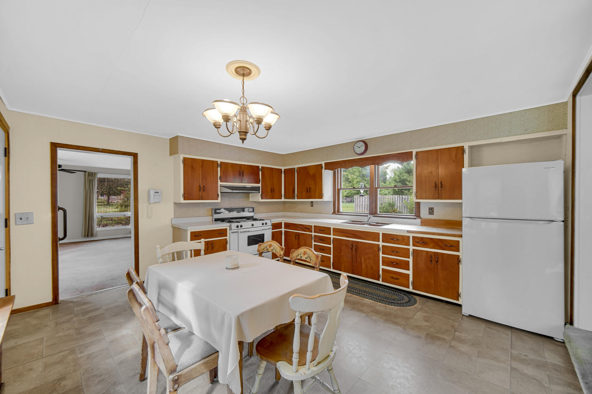 1288 North Brummitt Road Chesterton, IN 46304 - Photo 5 of 23 a view of a dining room with furniture a chandelier and window